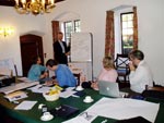 photo of discussions taking place between people in a workshop