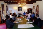 photo of discussions taking place between people in a workshop