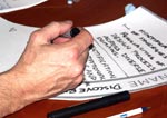 a photo of a man's hand writing
