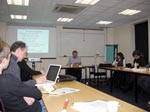 people sitting at tables during a workshop