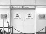 photo of doors with "no entry" at an airport