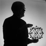 Silhouette of a man holding a 3d model 