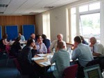 photo of discussion taking place in research cluster workshop