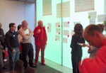 peope standing and observing thoughts recorded in a workshop